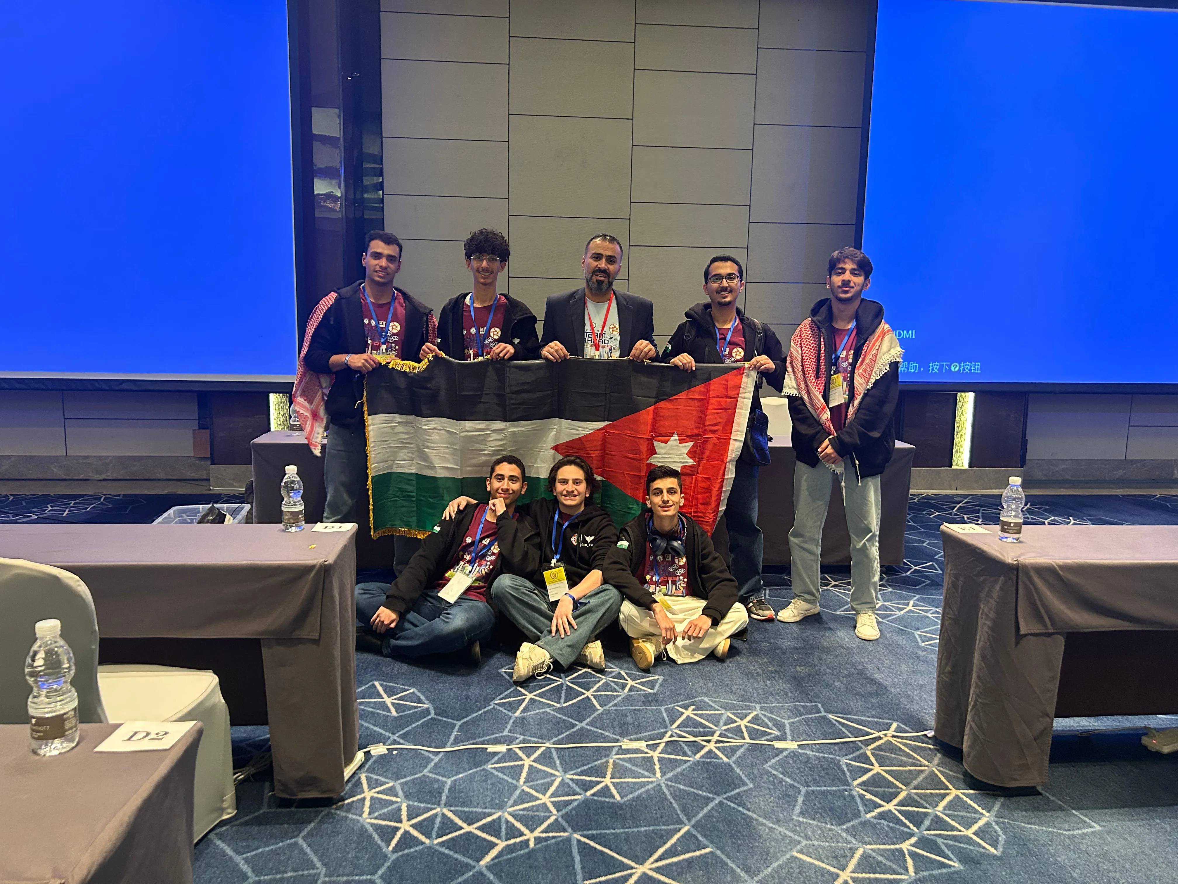 DoS_Team with the Jordanian flag at an international competition